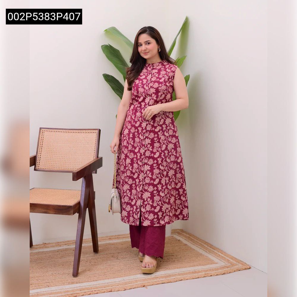 TRENDBUY model in maroon floral digital print sleeveless kurti with matching embroidered palazzo, holding a white shoulder bag, smiling.