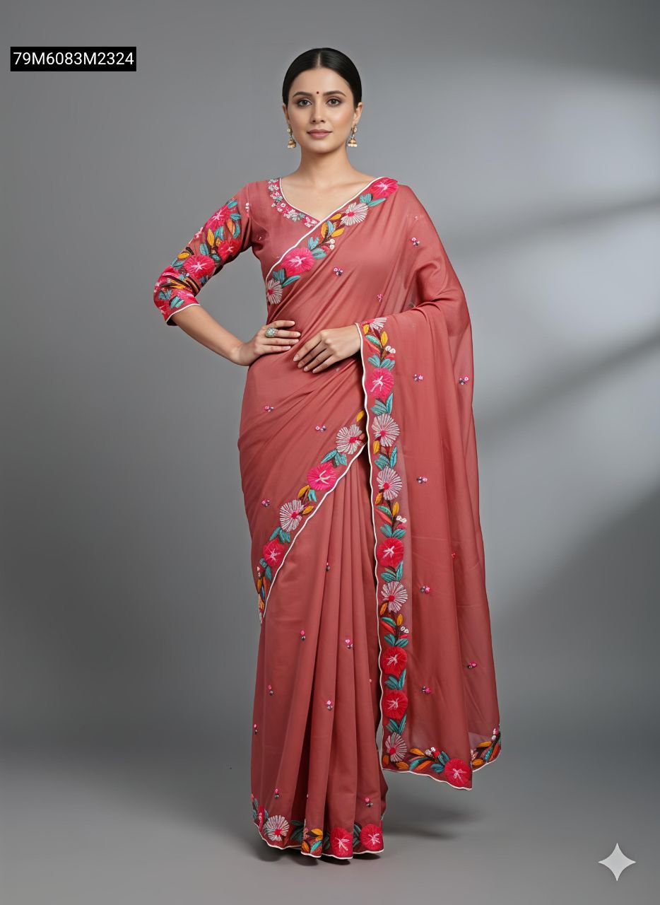 Model in Rosewood Pink TRENDBUY soft dola silk saree with vibrant floral embroidery on border and blouse.