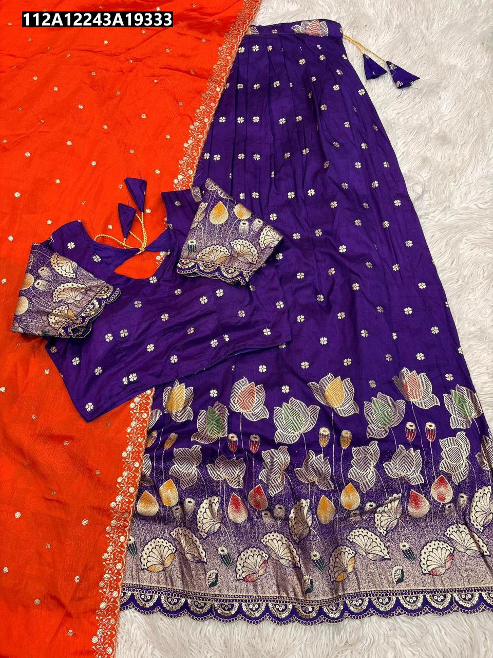 TRENDBUY Purple Half Saree Lehenga with intricate floral jacquard border, paired with an orange dupatta, laid flat on a white textured surface.