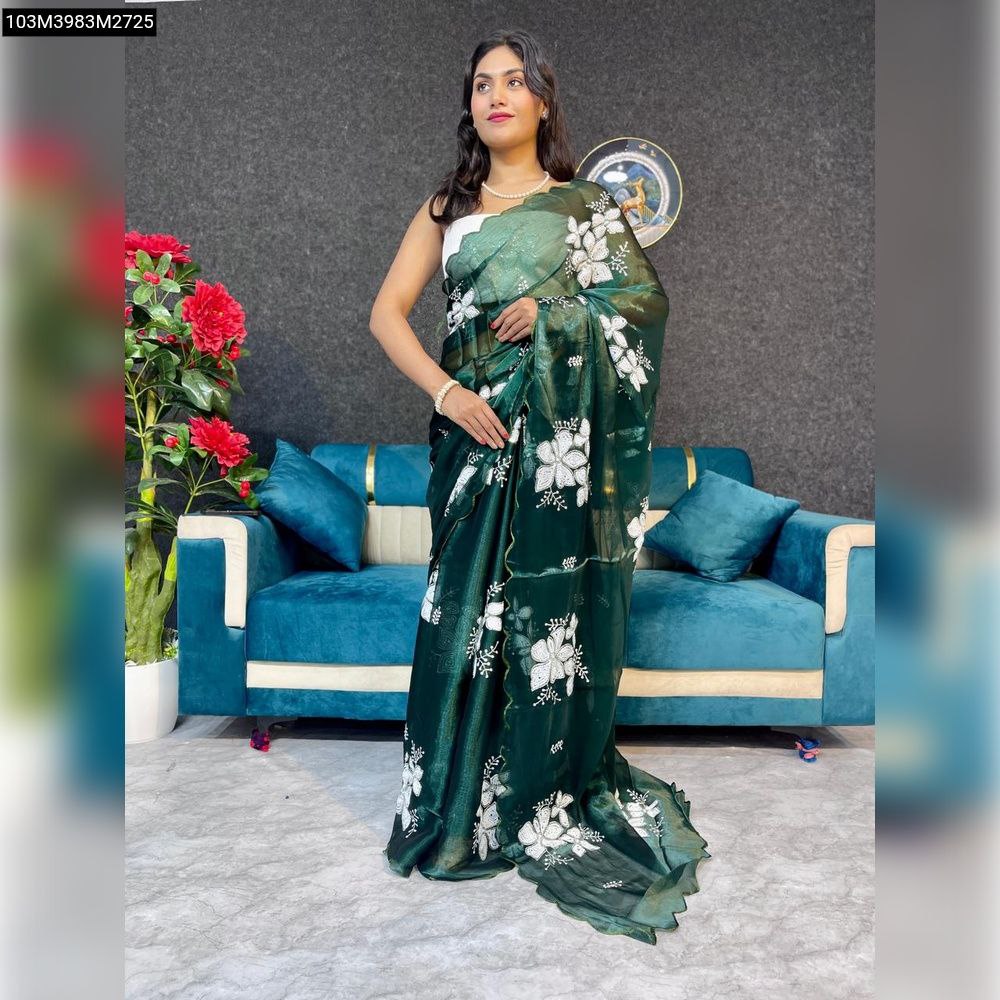 Model gracefully posing in a TRENDBUY Emerald Green Zimi Chu Saree featuring white floral 3mm sequence work and a delicate scalloped border.