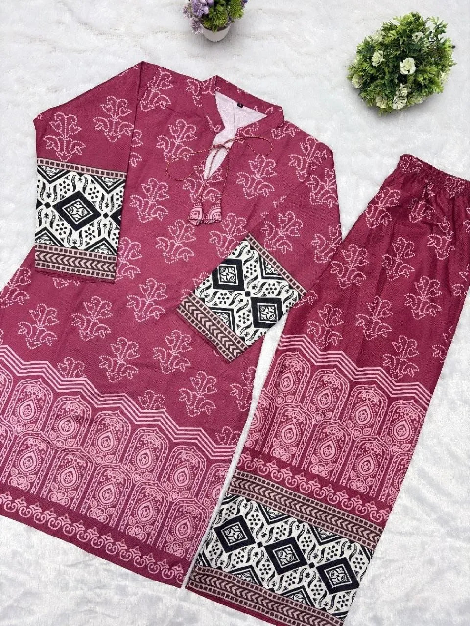 Maroon digital print cotton kurti and pant set laid flat on white surface