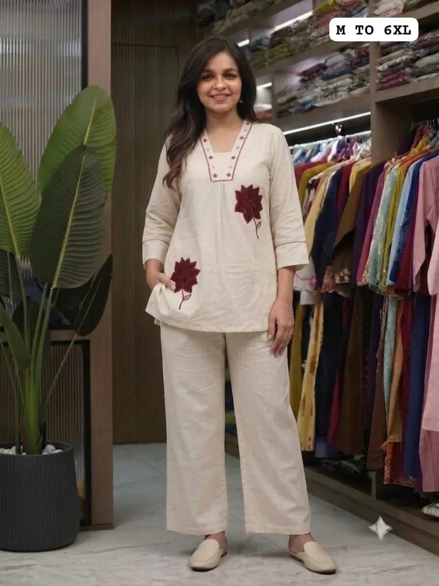 Model wearing off-white khadi cotton co-ord set with floral embroidery