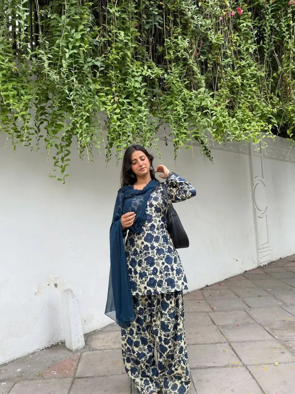 Woman wearing blue and off-white floral cotton farshi pant set outdoors