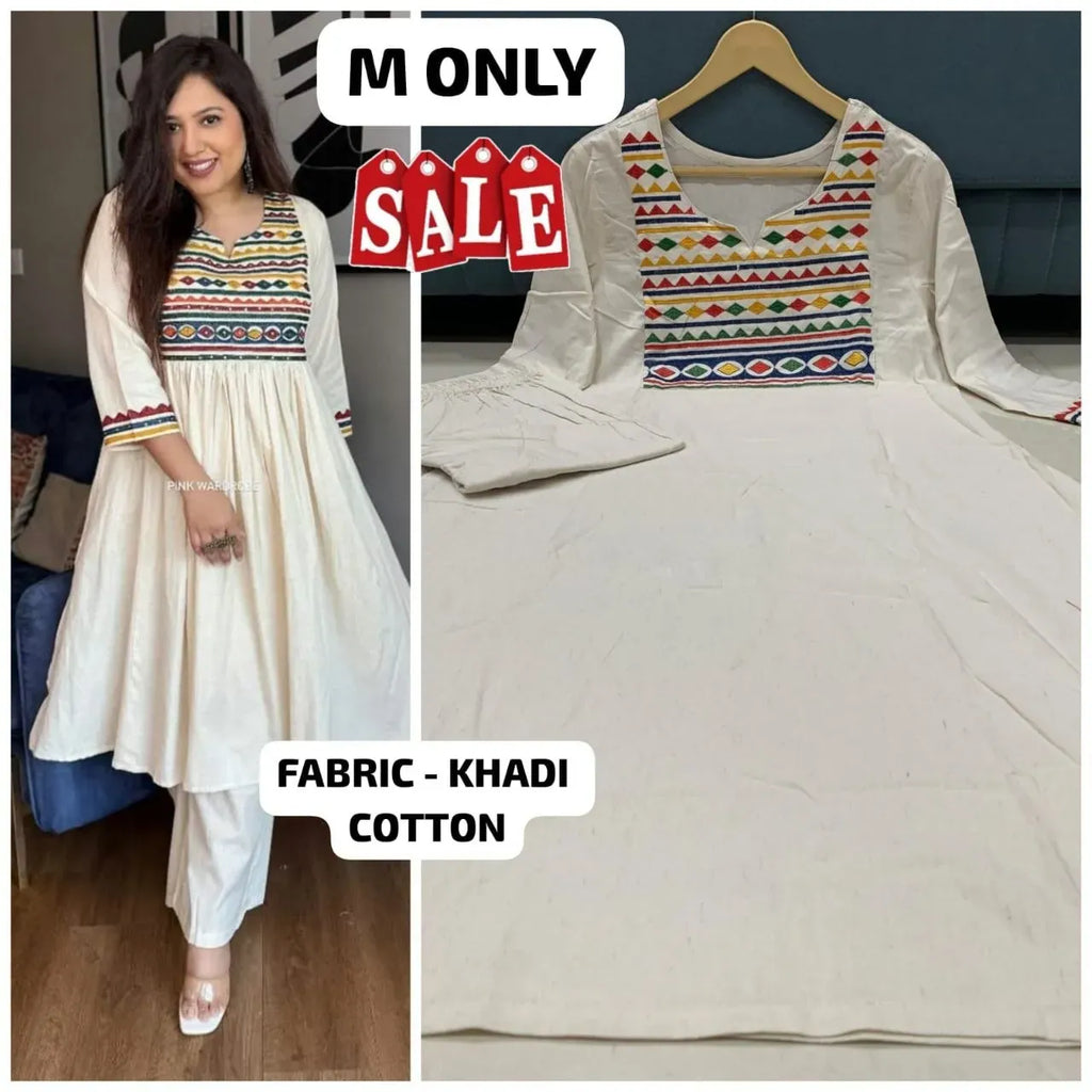 Model wearing white khadi cotton kurti with colorful neckline embroidery