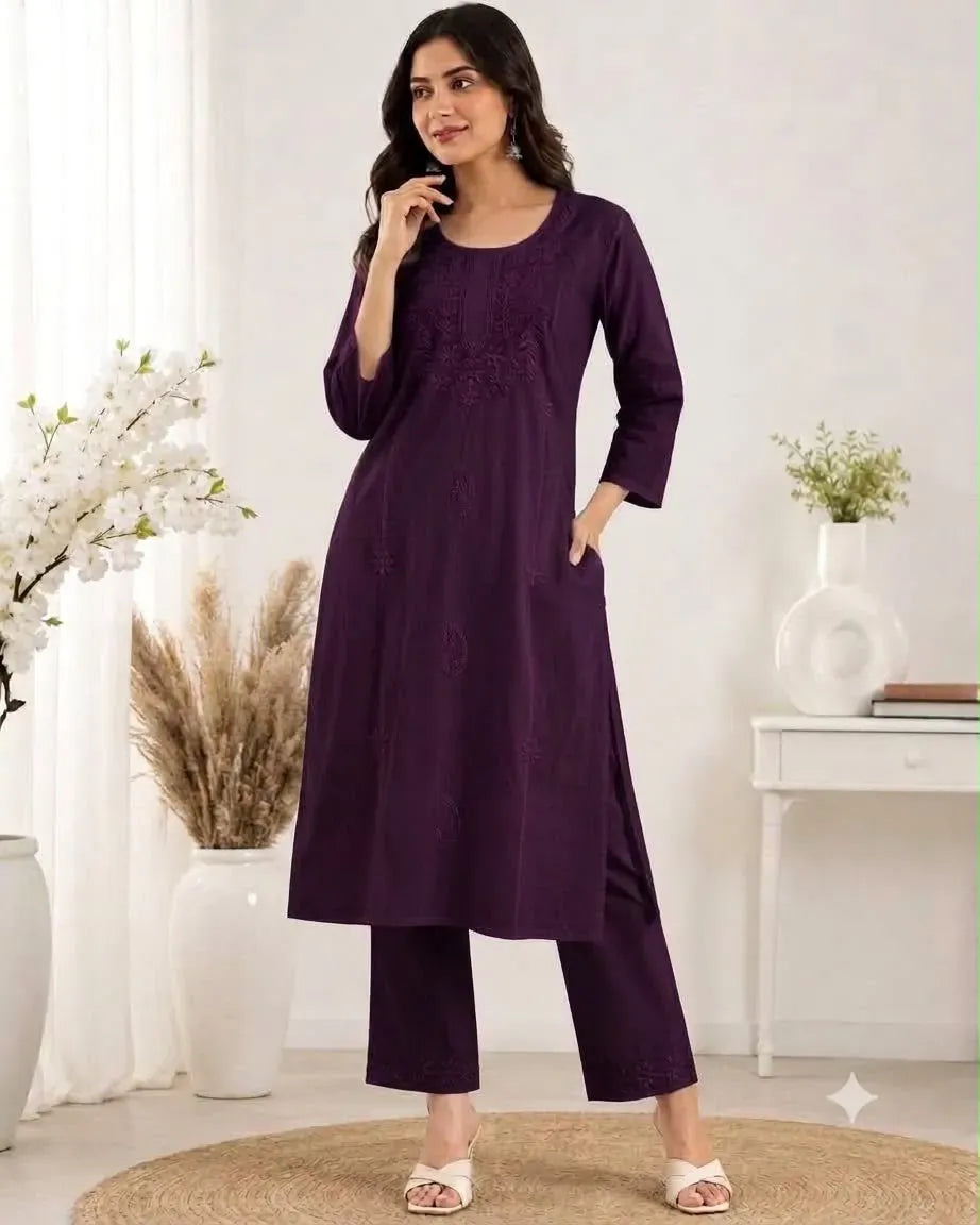 Model wearing purple cotton silk kurti set standing front facing