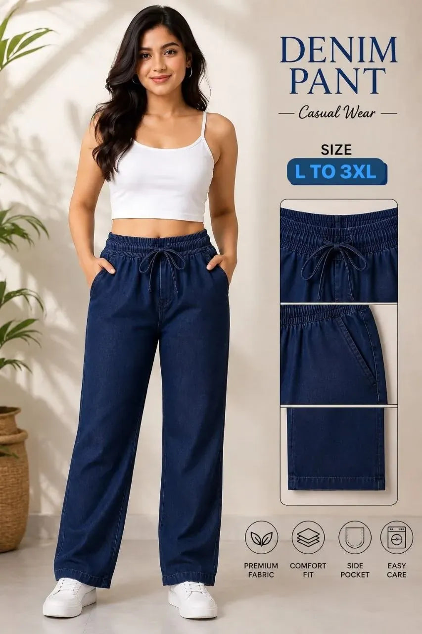 Model wearing dark blue denim pant with white crop top and sneakers