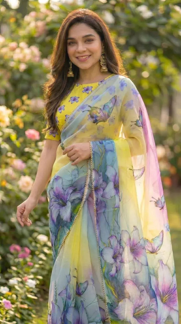 Woman wearing yellow digital print georgette saree with butterfly motifs