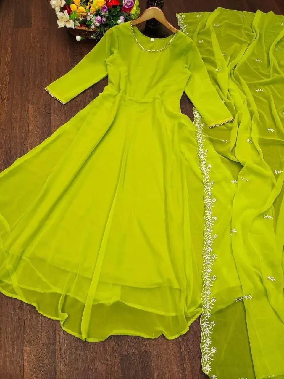 Full flat lay view of lime green embroidered georgette kurti and dupatta