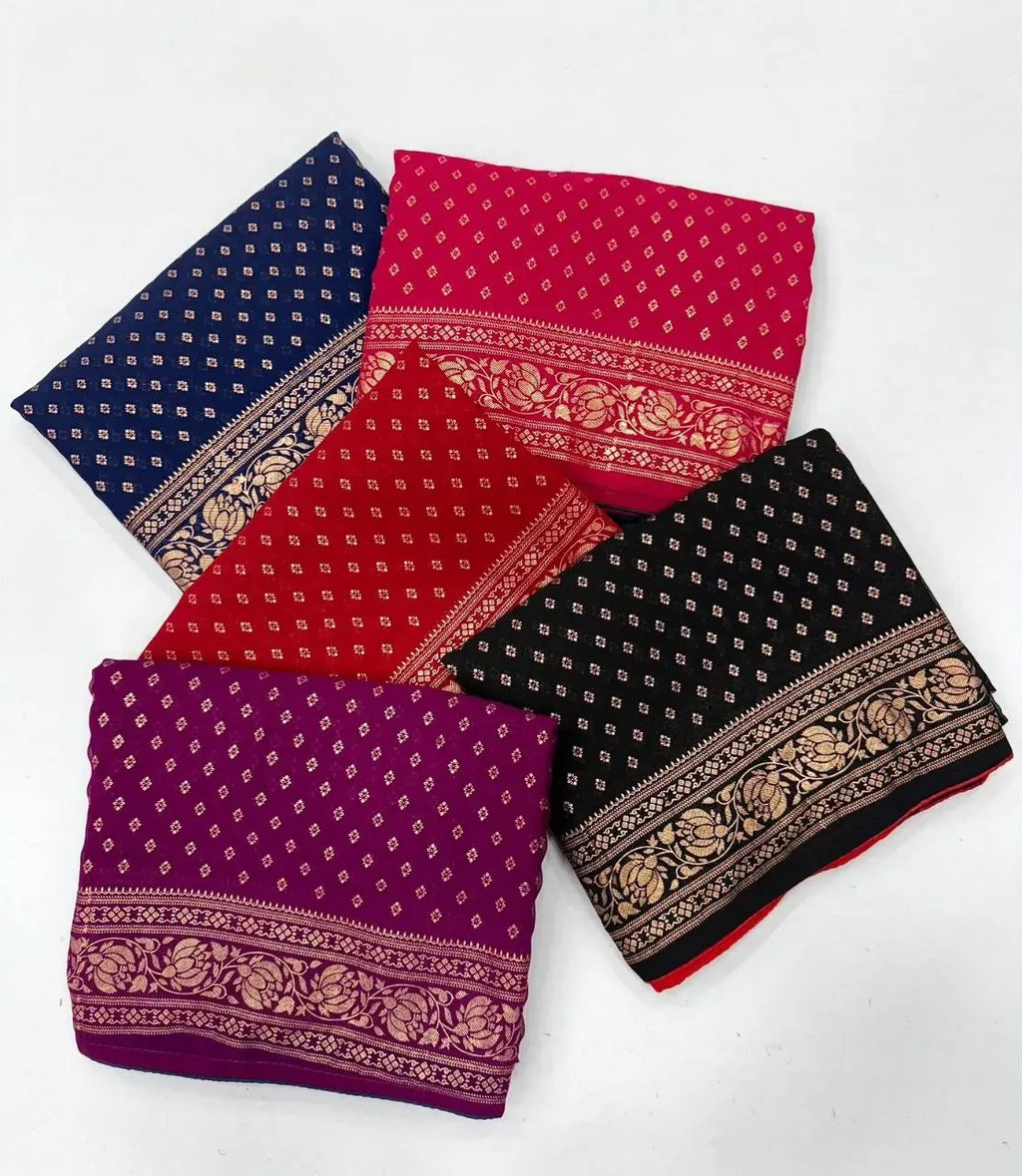 Four folded heavy georgette sarees in assorted vibrant colors and prints