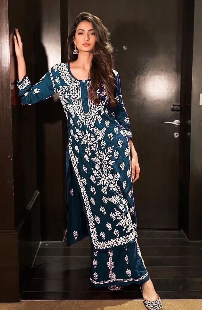 Model wearing dark blue heavy rayon cotton kurti set with white chikankari embroidery