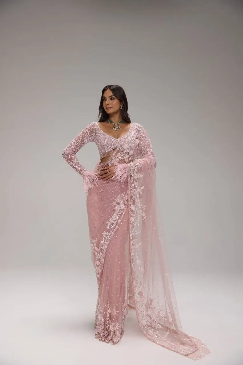 Lavender net sequins saree with heavy embroidered feather sleeve blouse