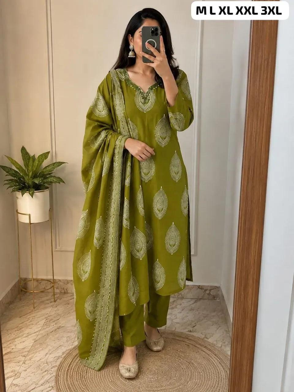 Model wearing olive green silk digital print kurti with matching pants and dupatta