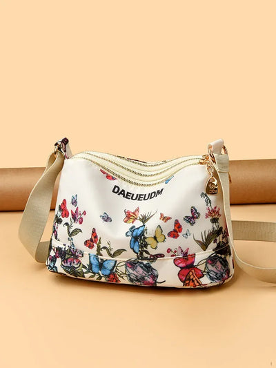 Trending Triple Zipper Sling Bag - Waterproof & Stylish for Women