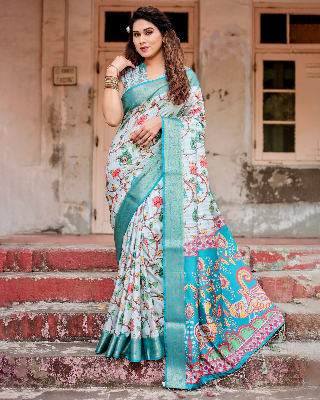 Model in full length wearing Aqua Elegance Tussar Silk Saree with floral print and sky blue border by TRENDBUY.