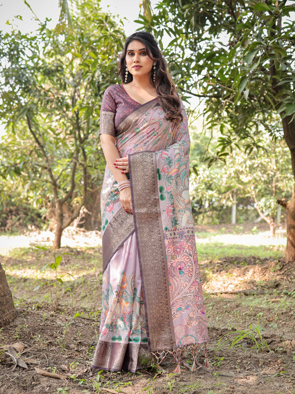 Woman posing elegantly in a Pastel Lavender & Beige Tussar Silk Saree with hand-painted digital ethnic prints and brown zari border, ideal for festive occasions.