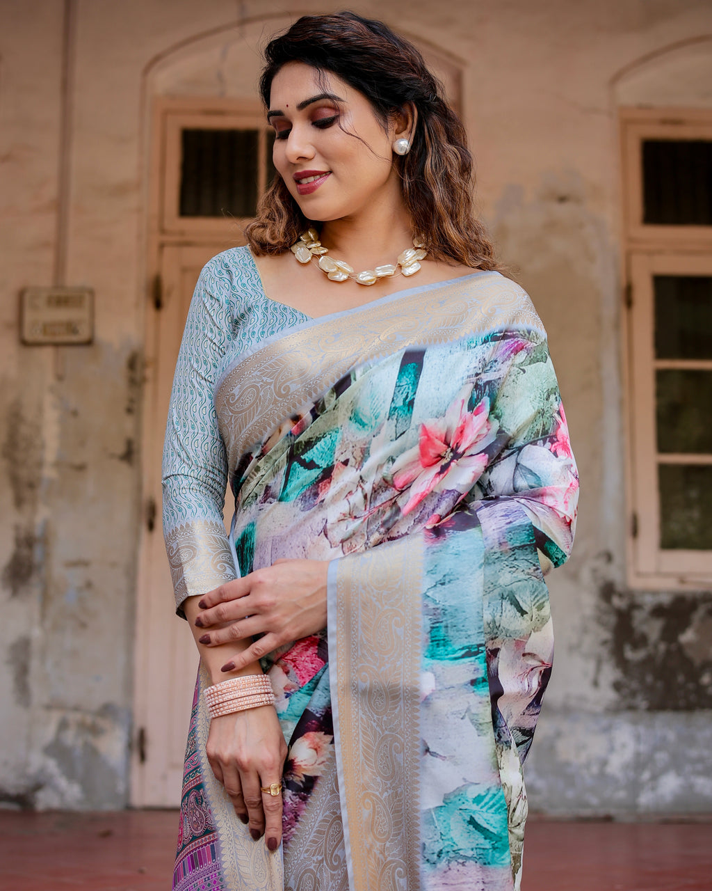 Woman wearing a Luxury Digital Print Tussar Silk Saree with abstract floral patterns and a zari border.