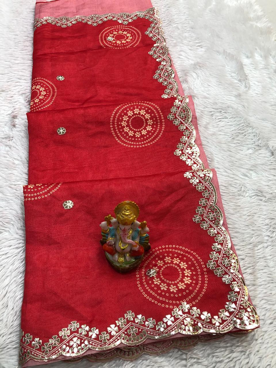Close-up of the delicate white thread embroidery along the scalloped border