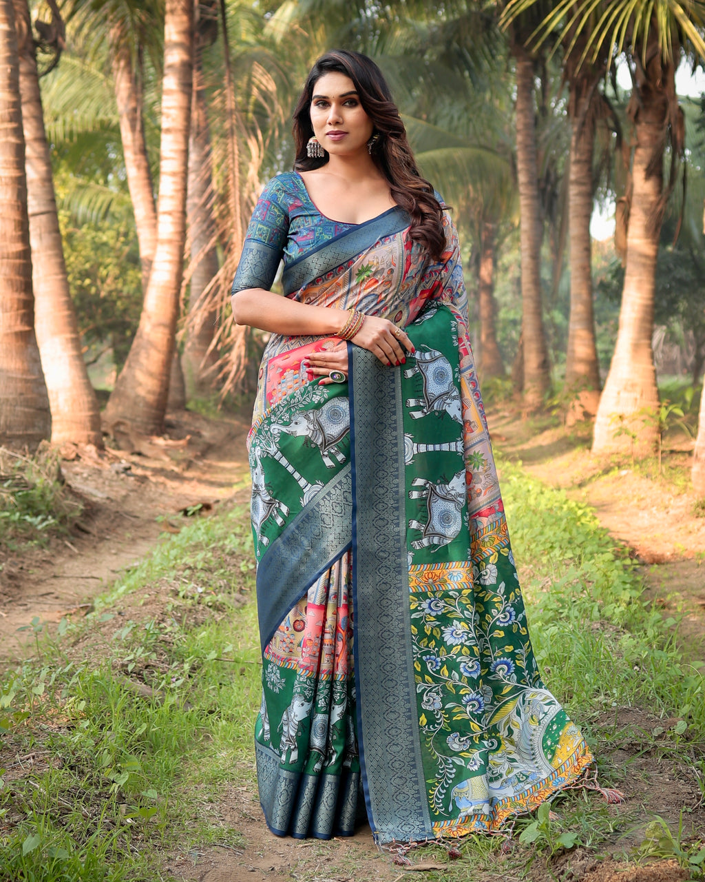 Elegant woman posing in a vibrant Tussar Silk Saree with traditional temple and elephant prints, set against a natural outdoor backdrop.