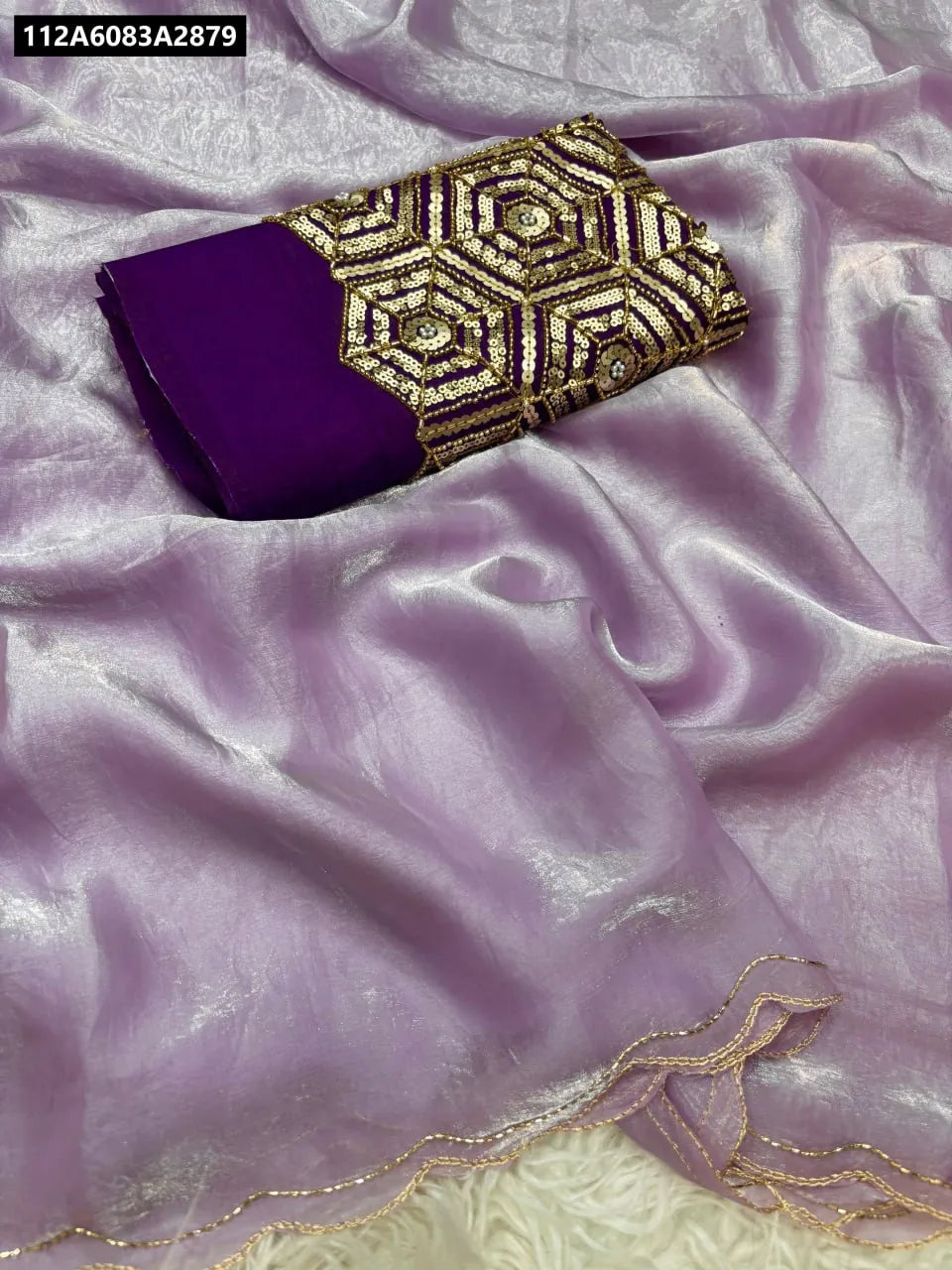 Lavender two-tone space silk saree with contrast dark purple designer blouse featuring gold sequin work