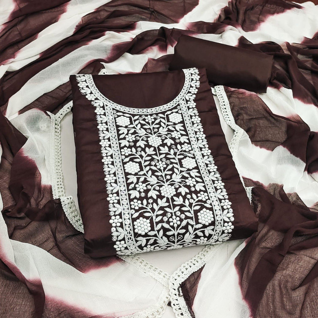Chocolate Brown Jaam Cotton Unstitched Salwar Suit with intricate white thread embroidery on the neckline, paired with a matching Naznin Shibori print dupatta and plain cotton bottom material by TRENDBUY.