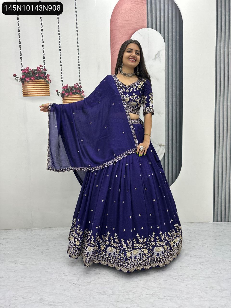 Woman in Royal Blue Vichitra Silk Embroidered Lehenga with sequence work, front view.