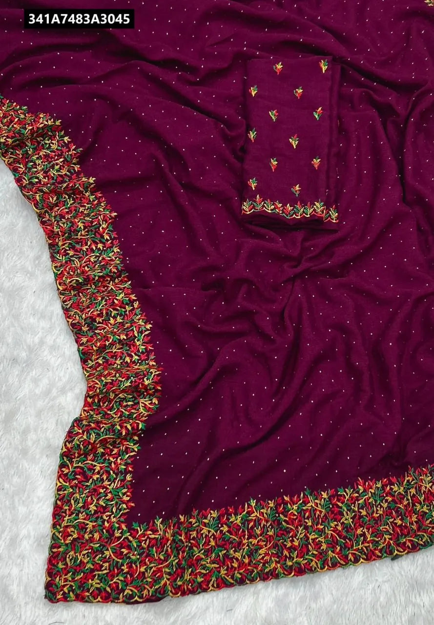 TRENDBUY Vichitra Silk Saree in Wine Purple with Zari Multi-Color Work and Stone Embellishments, showcasing the fabric and intricate border.