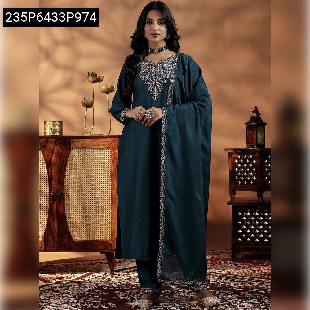 Front view of woman posing in a dark Teal Blue Vichitra Silk kurti set with sequence embroidery, suitable for festive wear.