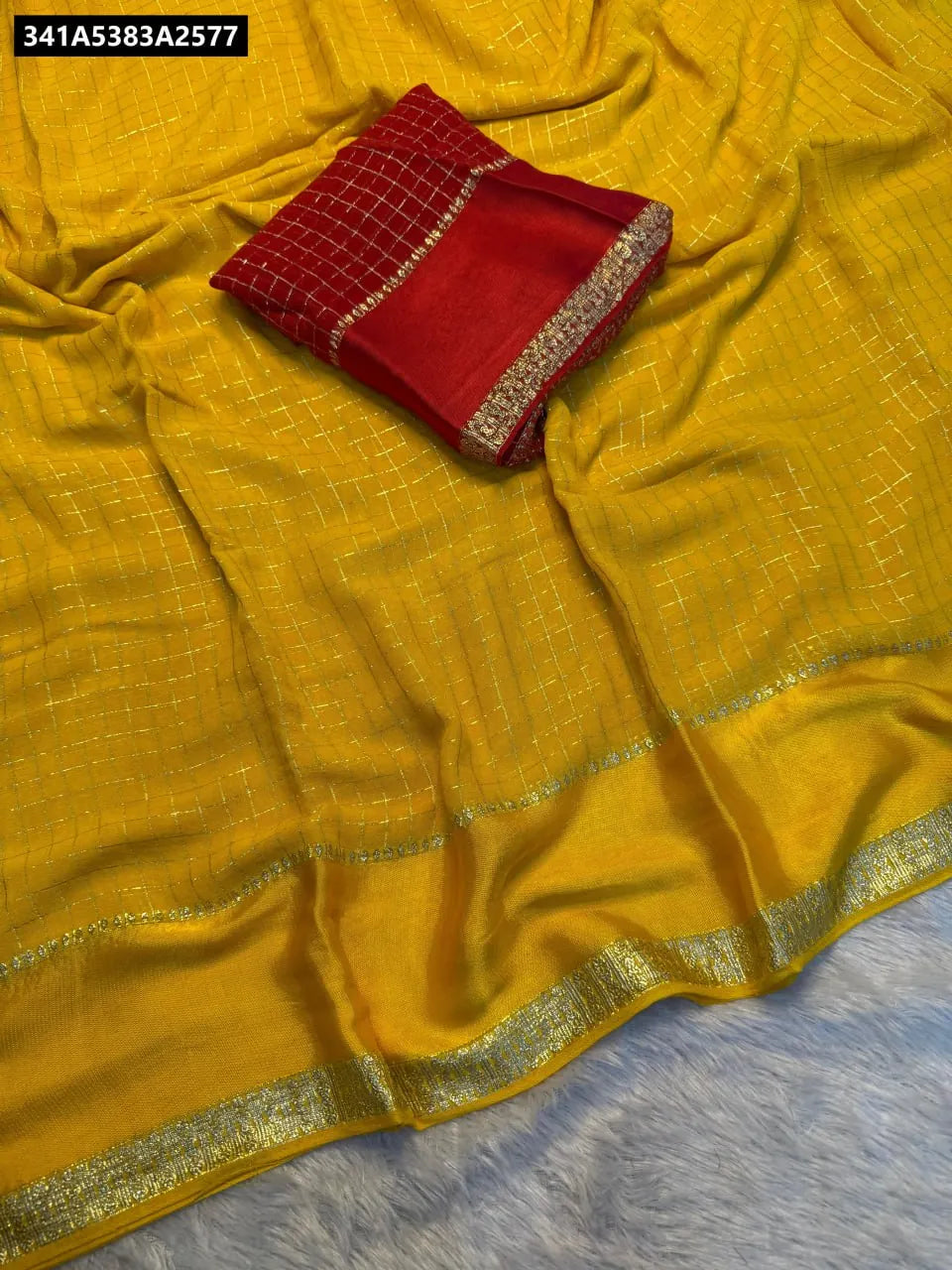 TRENDBUY Viscose Georgette Saree in Yellow with Red Blouse Piece - Flat lay