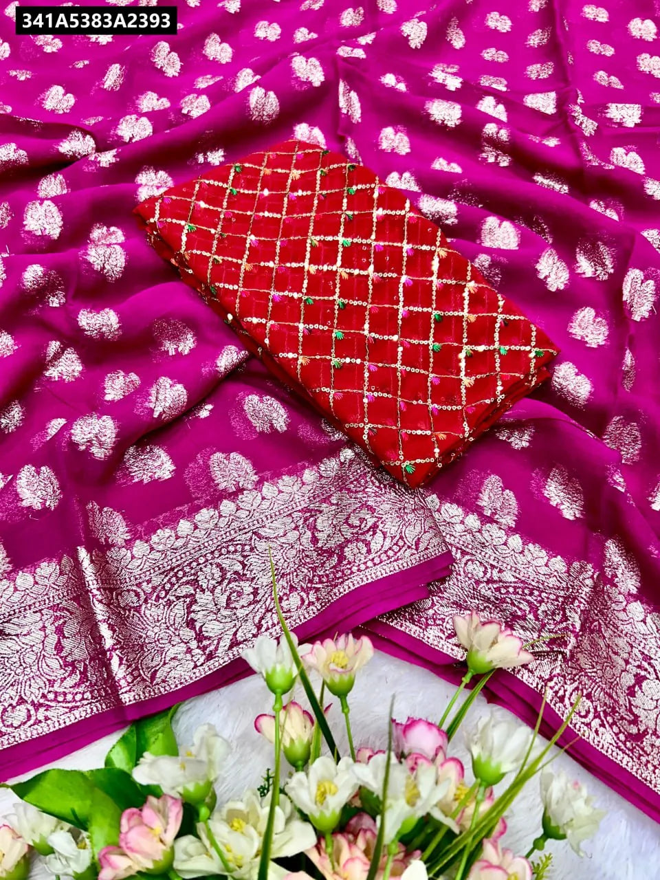 Fuschia Pink Viscose Georgette Saree with intricate silver zari work and a contrast red sequin embroidered blouse, displayed as a flat lay.