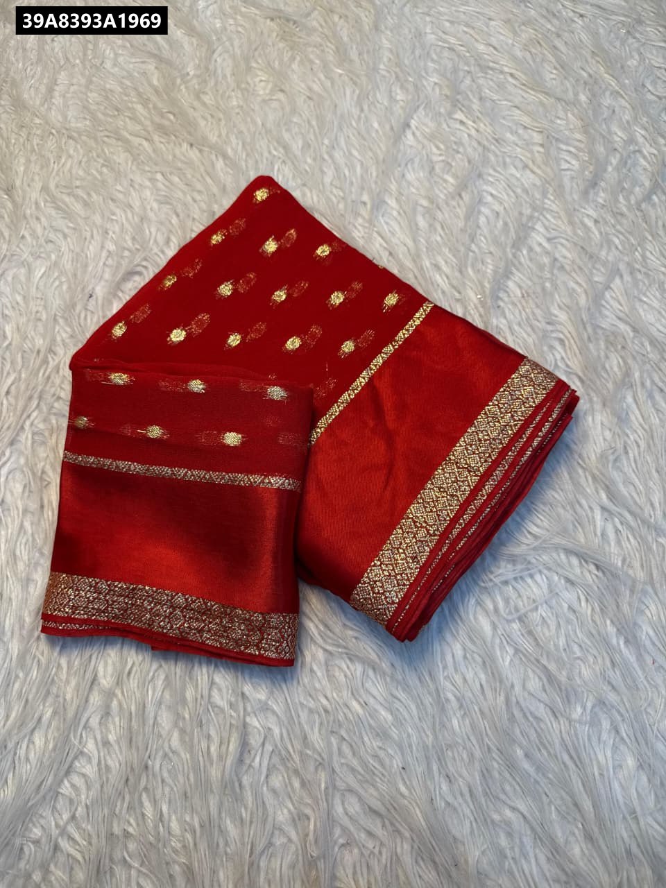 TRENDBUY Red Viscose Georgette Saree with matching blouse, folded on white background.