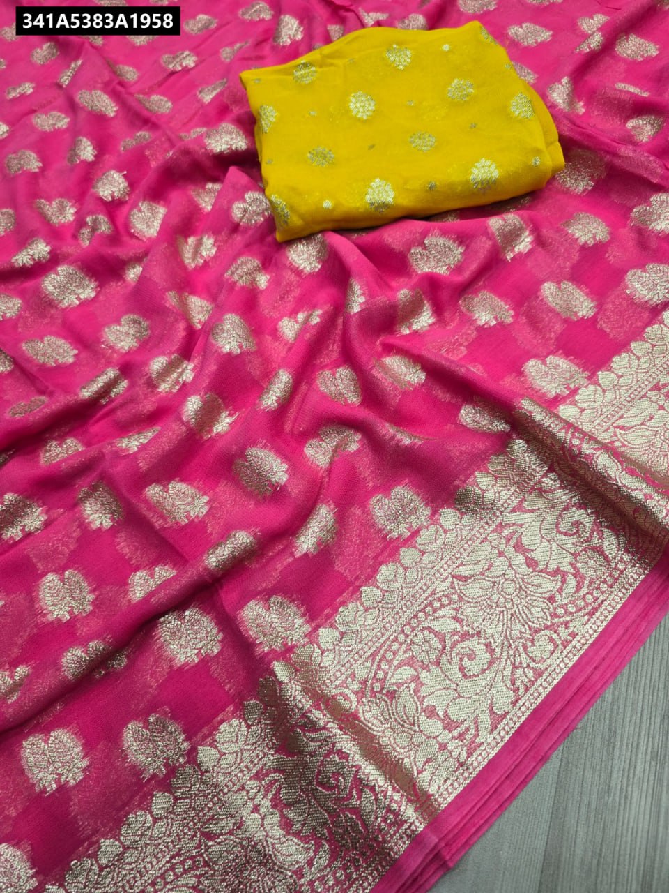 Fuchsia Pink Viscose Georgette Saree with intricate gold weaving and yellow contrast blouse