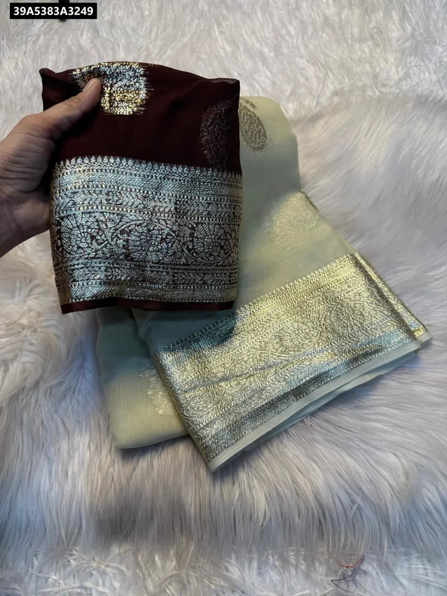 TRENDBUY Pure Viscose Georgette Weaving Jacquard Saree in Cream with contrast maroon blouse piece, flat lay.