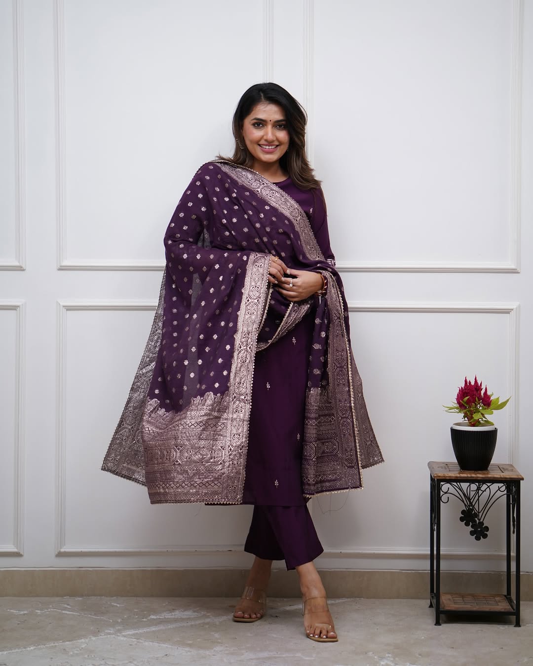 Model smiling, wearing the full TRENDBUY ST-SWATI wine kurti set with a striking pose, showcasing the richness of the color and the traditional design.