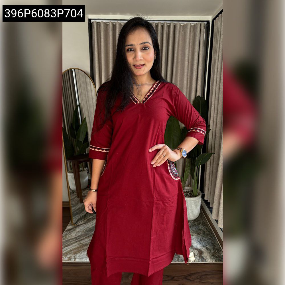 Model wearing Maroon A-Line Dhabu Kurti and Pant set, front pose.