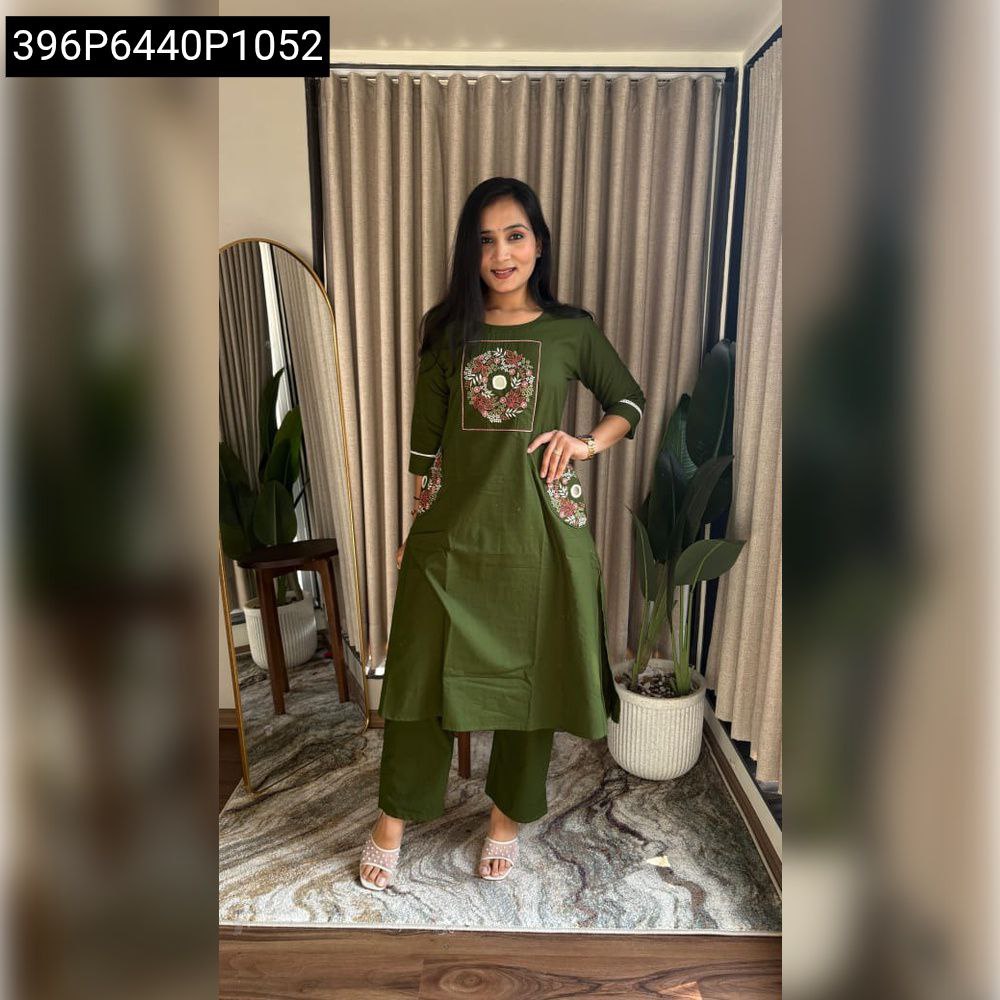 Full body shot of a woman wearing an olive green Dhabu Cotton Aline Kurti and matching Plazo Pants, showing the complete embroidered ethnic set.