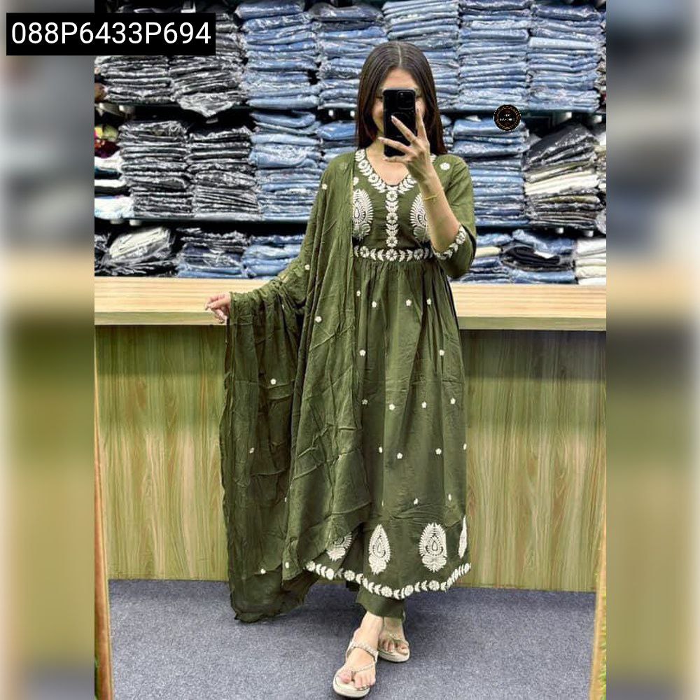Woman wearing green cotton Anarkali kurta set with white hand work embroidery on yoke and hem, full view.