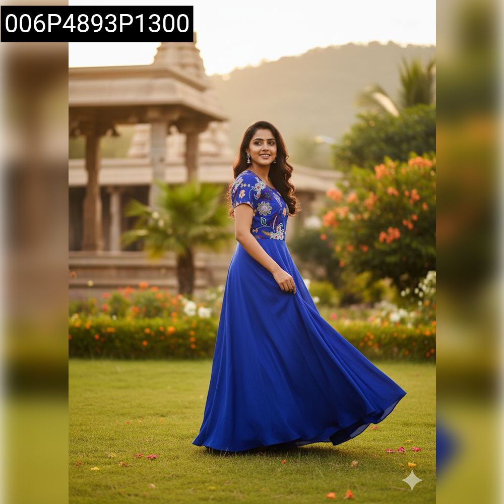 Model in Royal Blue Chinnon Silk Anarkali Gown with Jari embroidery, outdoor temple backdrop.