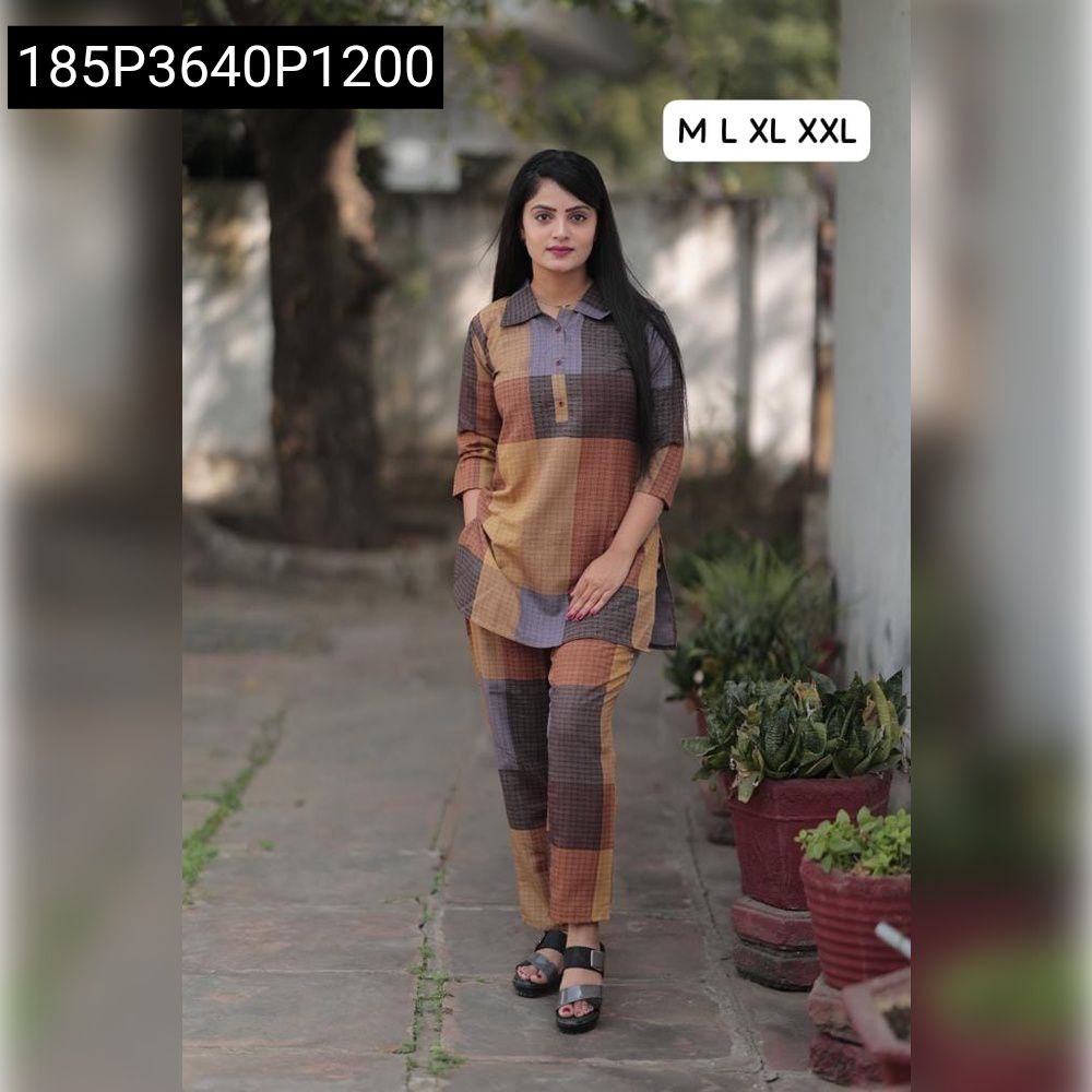 Woman posing front in earthy checkered cotton co-ord set, full body shot.