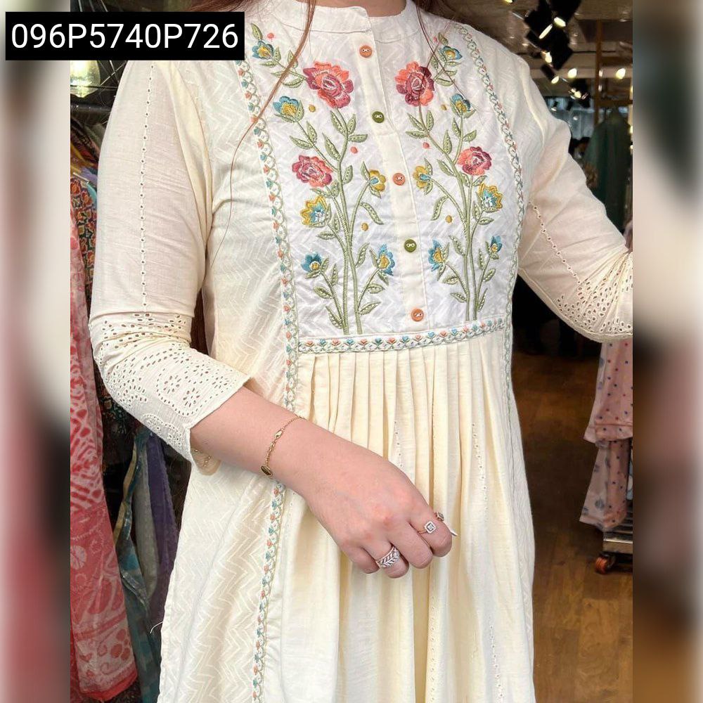 Model wearing the women's cream cotton dobby kurti with floral embroidery, side view