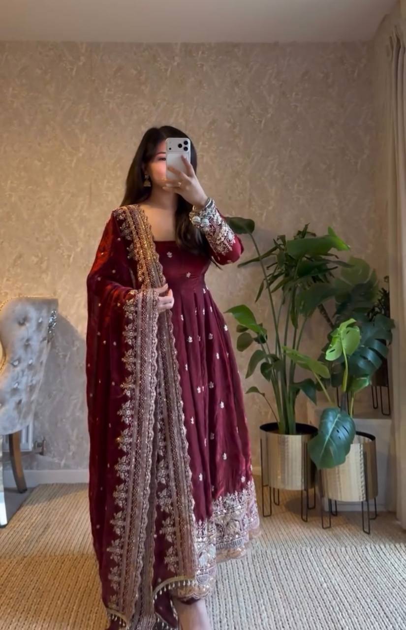 Woman wearing maroon Georgette gown with sequence embroidery and dupatta, full body mirror selfie