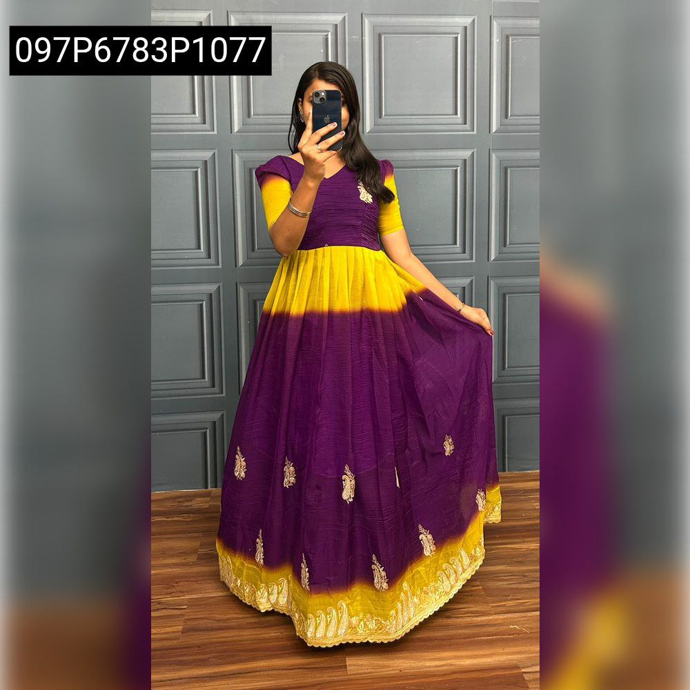 Full body shot of a woman in a purple and yellow dual-shade crunchy crush gown, posing.