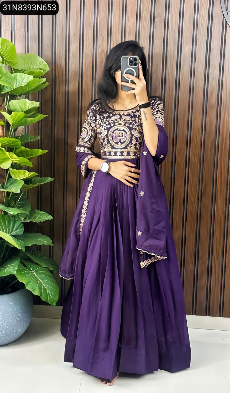 Full body shot of a model wearing a Purple Georgette Gown with heavy embroidery, front view.