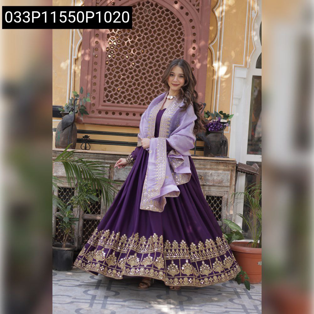 Woman posing in purple embroidered georgette gown with lavender dupatta against an ornate wall.