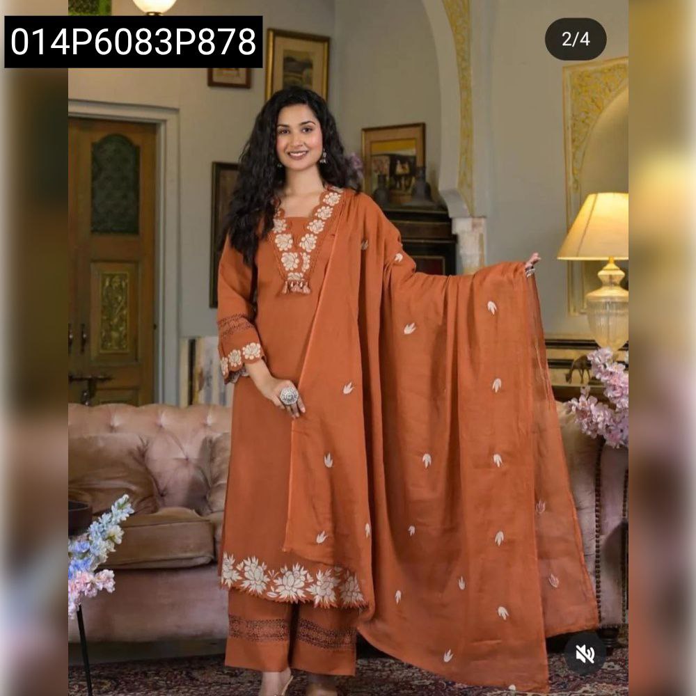 Full body shot of model elegantly posing in the Terracotta Embroidered Kurti Suit set.
