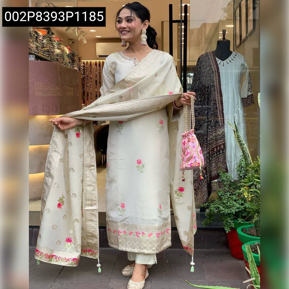 Full body shot of a model posing gracefully in the cream embroidered shimmer jacquard kurta set with plazo pants and dupatta, smiling indoors.
