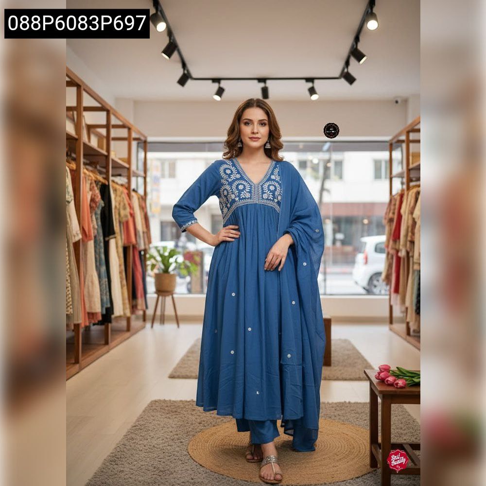 Full body shot of model in a blue embroidered cotton kurta set with malmal dupatta, posing elegantly.