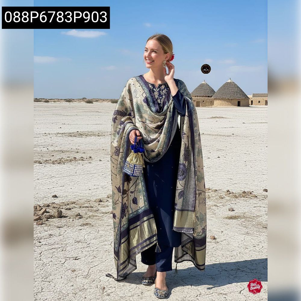 Full body shot of a woman in navy embroidered kurta set standing in a vast, open landscape, showcasing the complete attire.