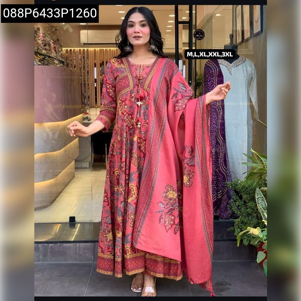Woman in Coral Red embroidered Anarkali kurti set.