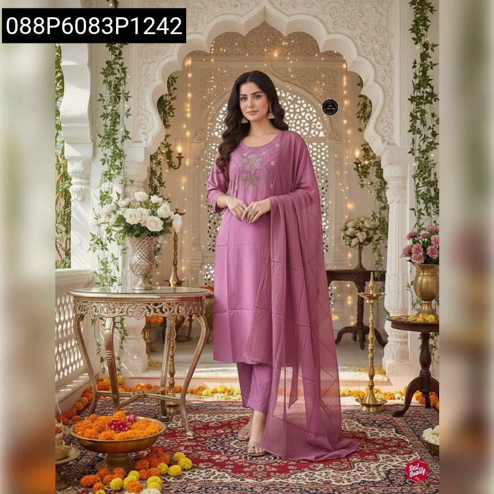 Elegant woman posing in a full body shot, wearing a lavender embroidered cotton kurta set with a flowing mulmul dupatta, in a traditional archway setting.