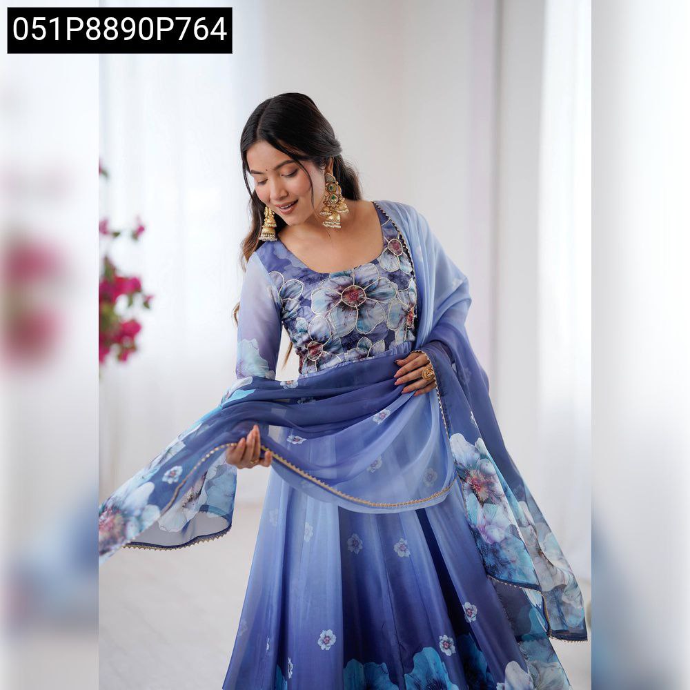 Elegant woman in a Lavender Blue Ombre floral digital print anarkali gown, looking down at her dupatta.